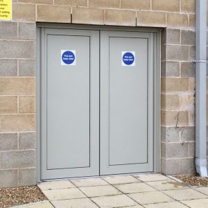 For secure doors such as these to a school, alumnium panels provide greater protection than obscure glass. 