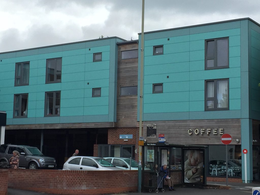 powder coated aluminium insulated panels in a retail setting above a coffee shop