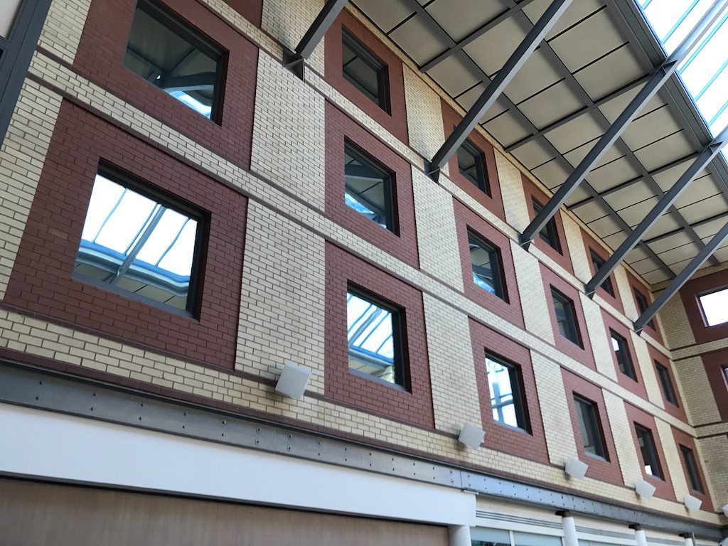 aluminium vision panels in a hotel building, looking into a lobby