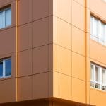 yellow energy efficient aluminium panels in a modern apartment building